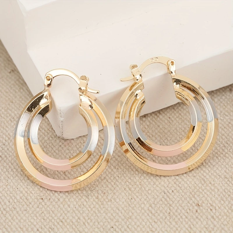 Circular Radiant Gold Earrings — image 1