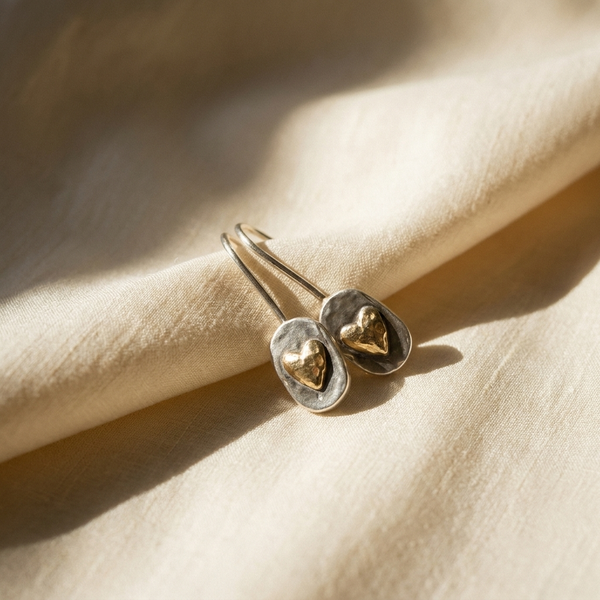 Maison Osonn earrings on cream silk