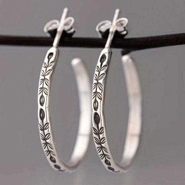 Sleek Silvery Hoop Earrings — image 1