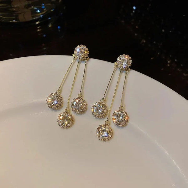 Tertia Honoria Shimmering Earrings — image 1