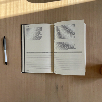 Open interior spread showing printed study layout and note lines on cream paper