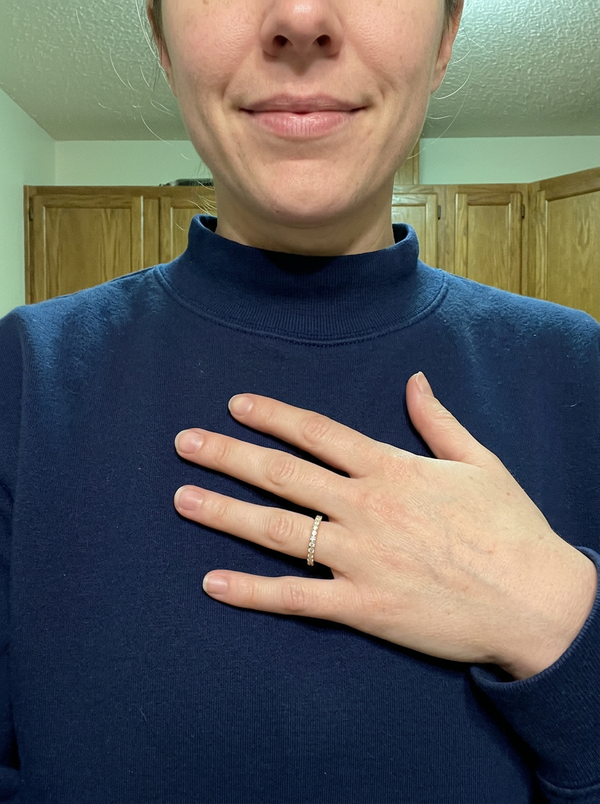 Maison Osonn Aurélie Signature Pavé Ring worn on a hand resting on the chest