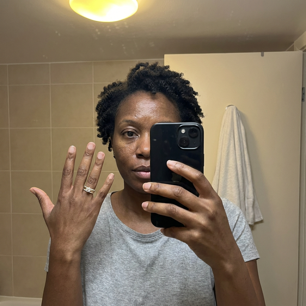 Maison Osonn Célestine Radiance Stacked Ring worn in a bathroom mirror photo