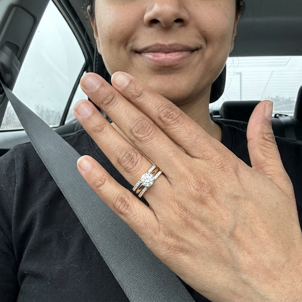 Maison Osonn Célestine Radiance Stacked Ring worn on a hand held up in a car